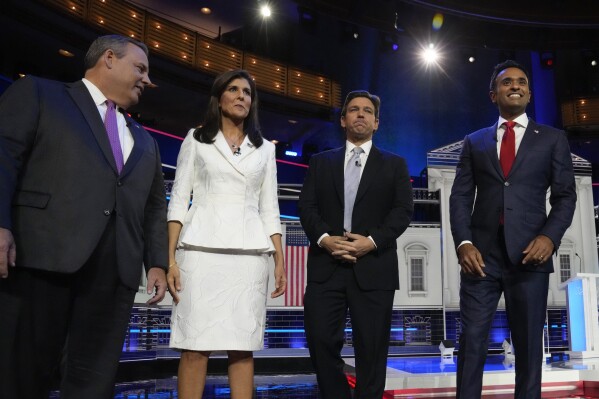 Republican presidential candidates from left, former New Jersey Gov. Chris Christie, former UN Ambassador Nikki Haley, Florida Gov. Ron DeSantis, and businessman Vivek Ramaswamy stand on stage before a Republican presidential primary debate hosted by NBC News Wednesday, Nov. 8, 2023, at the Adrienne Arsht Center for the Performing Arts of Miami-Dade County in Miami. (AP Photo/Wilfredo Lee)